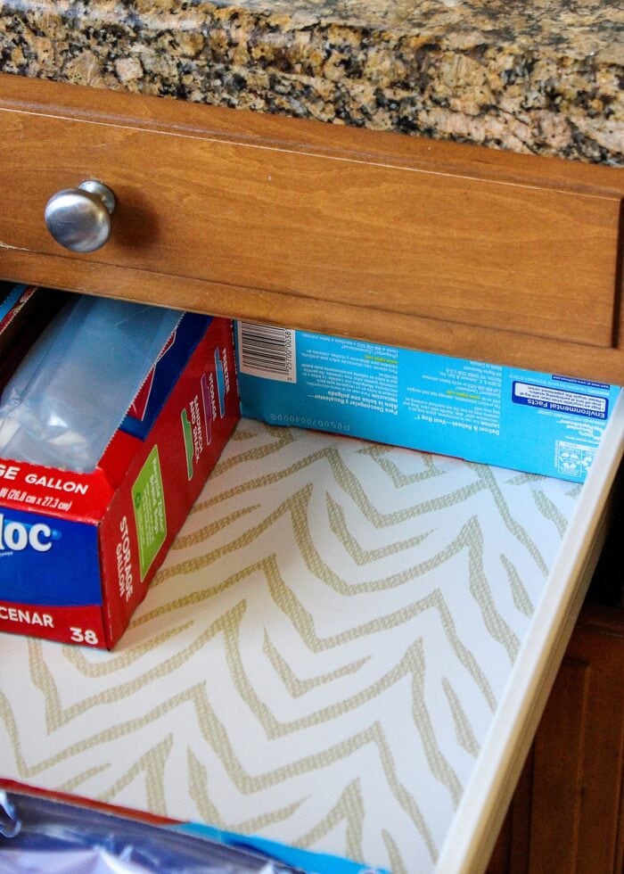 A kitchen drawer holding boxes of Ziplock bags