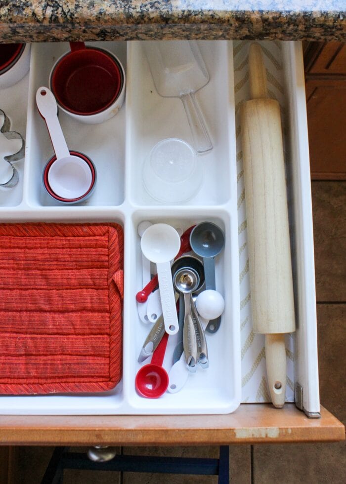 Group measuring spoons and cups together when organizing kitchen drawers