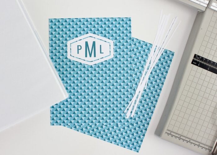 White margins sliced off printable binder covers with a paper trimmer