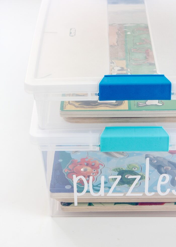 Puzzles inside lidded plastic bins