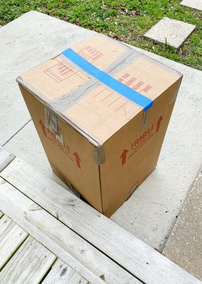 Moving box with blue length of tape