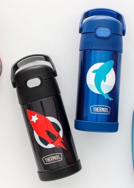 Water bottles shown with waterproof stickers on them