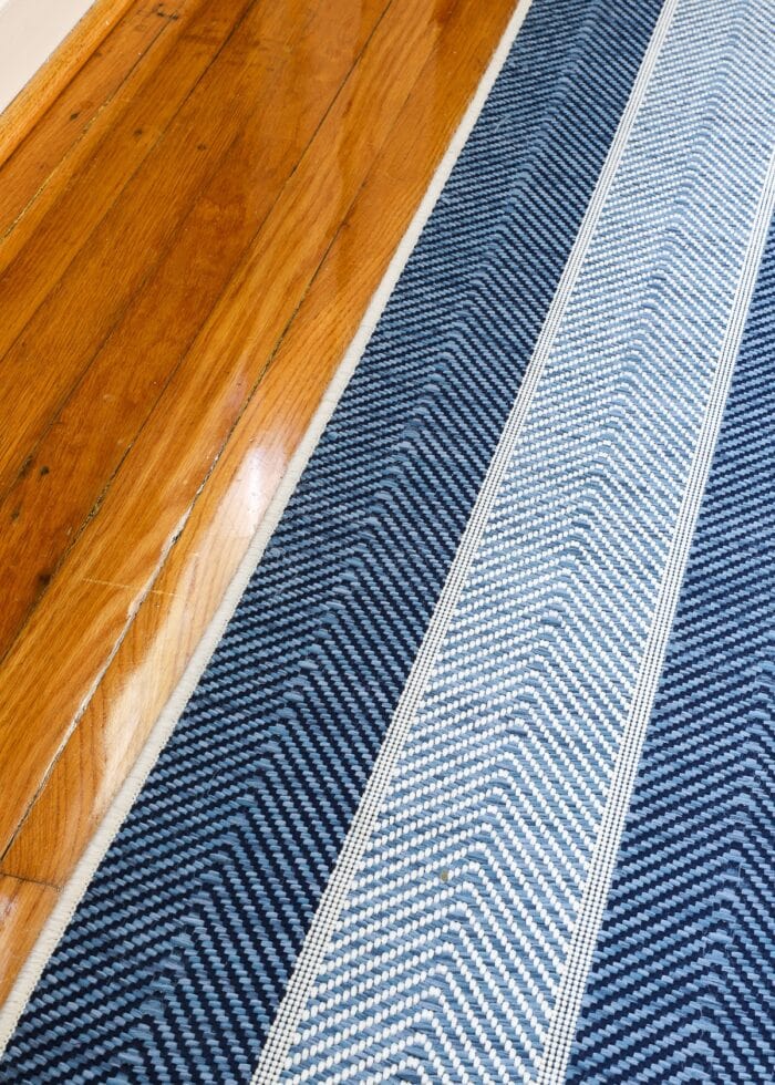 Closeup of blue chevron woven rug