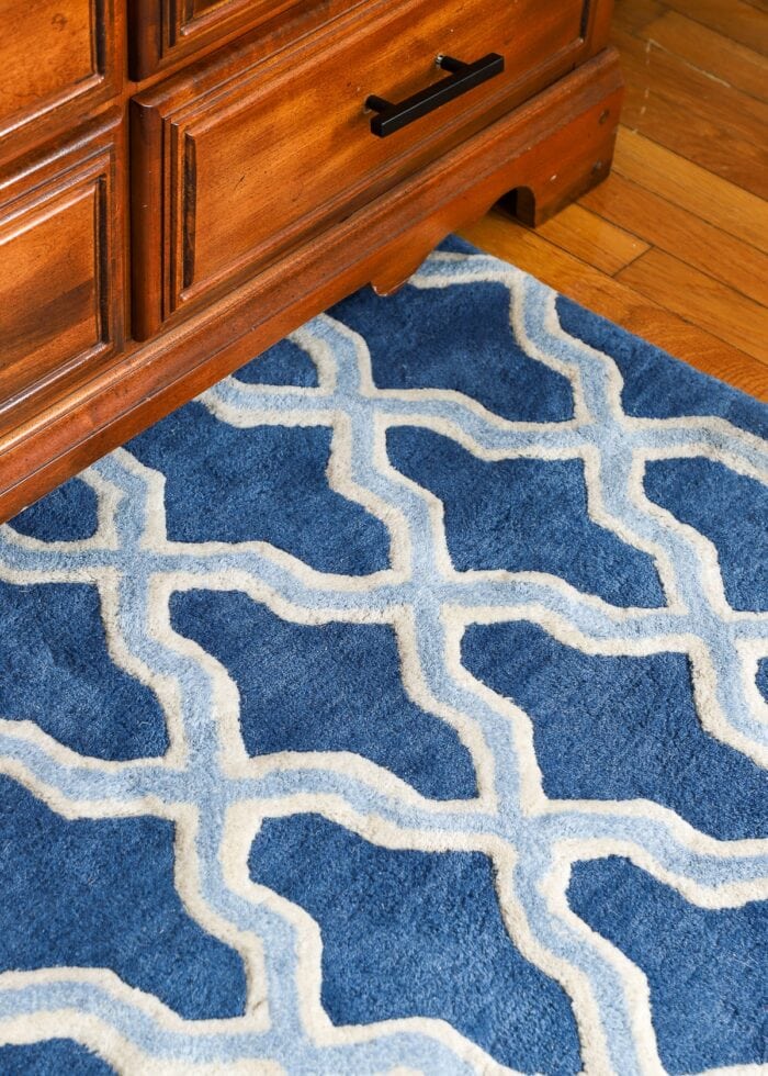 Closeup of blue and white tufted wool rug