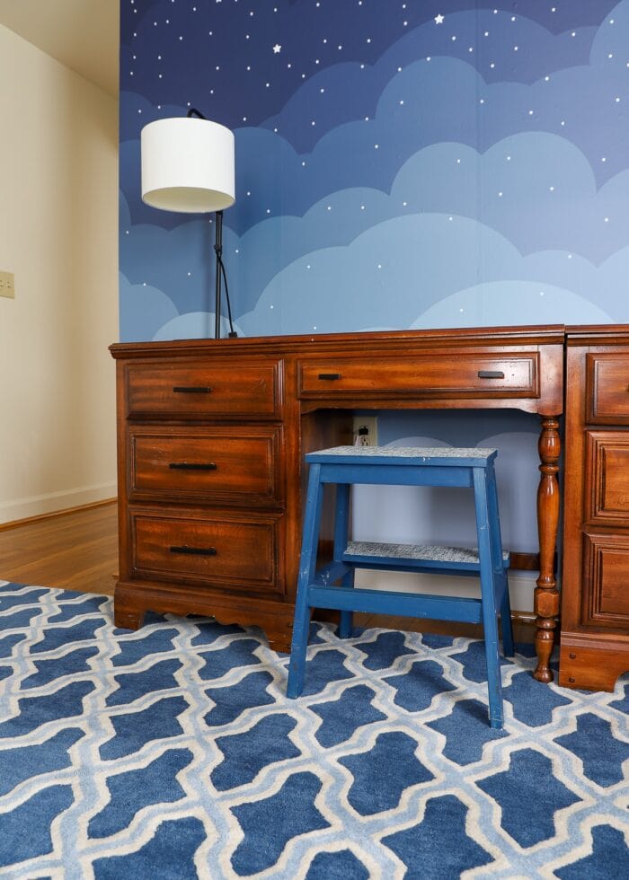 Blue Trellis Wool Rug (9x12') from Target under wooden desk and dresser