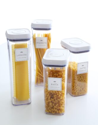 Four pantry canisters with Cricut-made labels