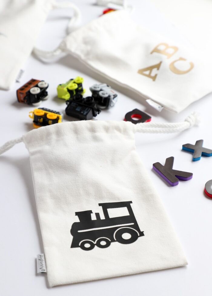 Small canvas pouches serving as small toy storage