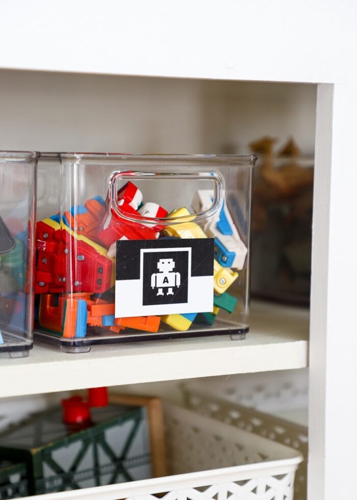 Clear acrylic bins serving as small toy storage