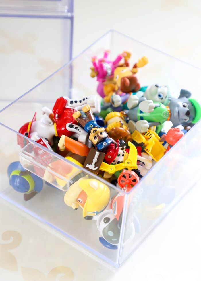 Removable plastic drawers holding small toys