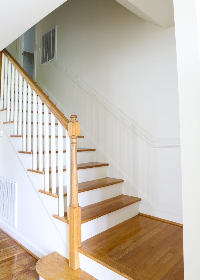 Stairwell with wooden treads and white walls