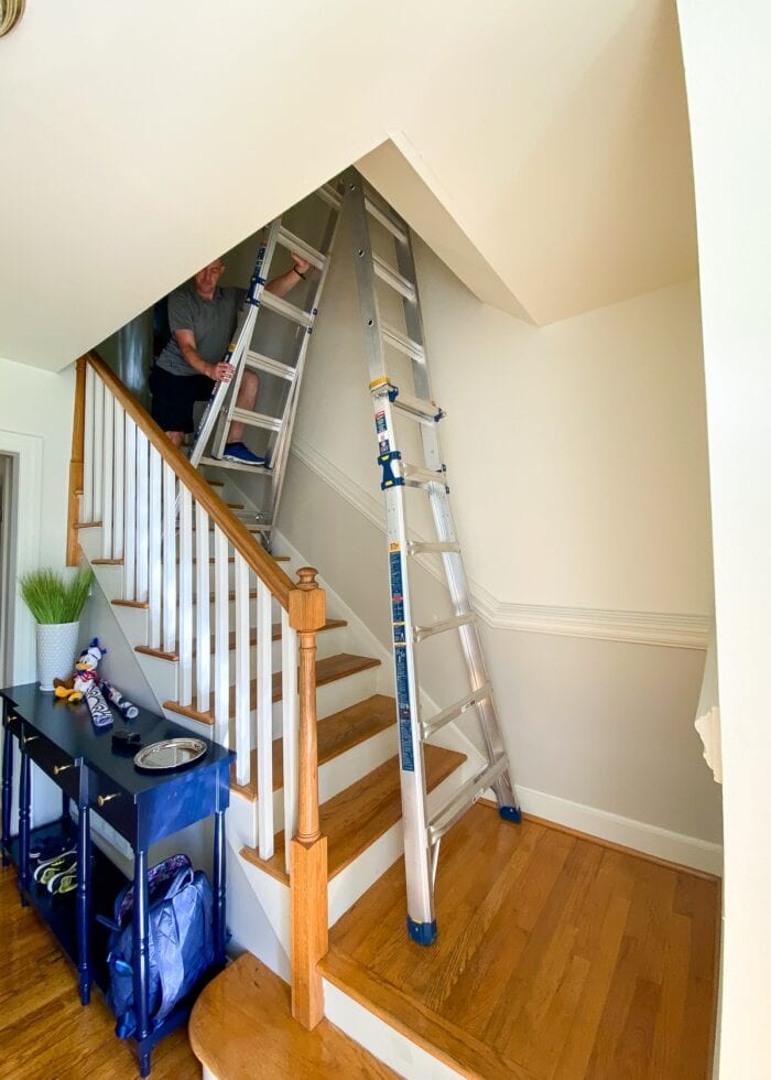 An extension ladder positioned in a stairwell