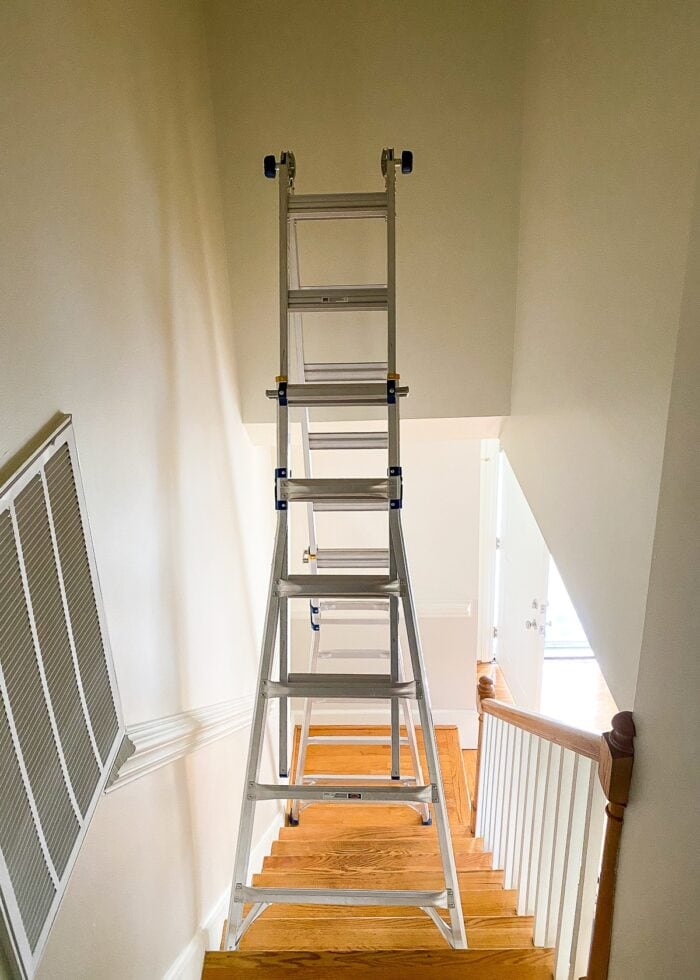 An extension ladder positioned in a stairwell