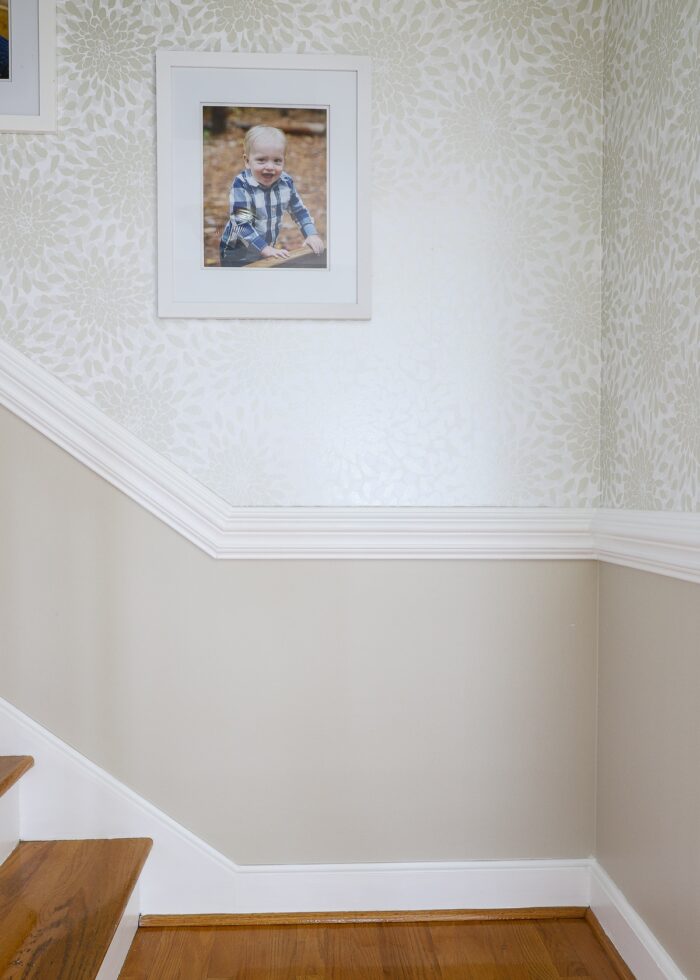 Toss the Bouquet wallpaper on stairwell with white frames