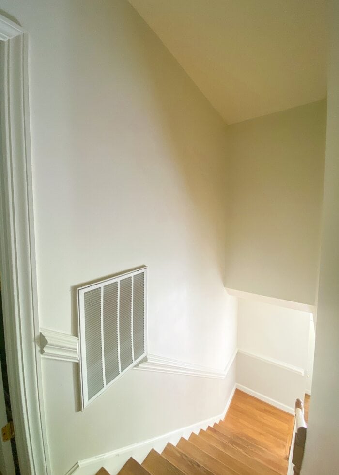 A blank high stairwell wall
