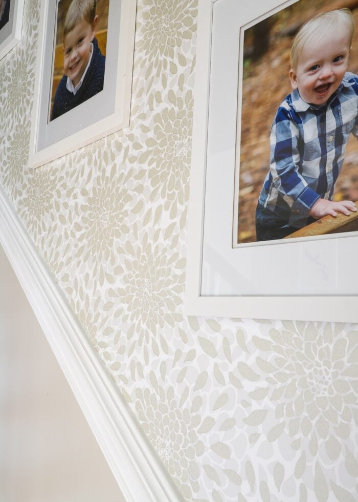 Toss the Bouquet wallpaper on stairwell with white frames
