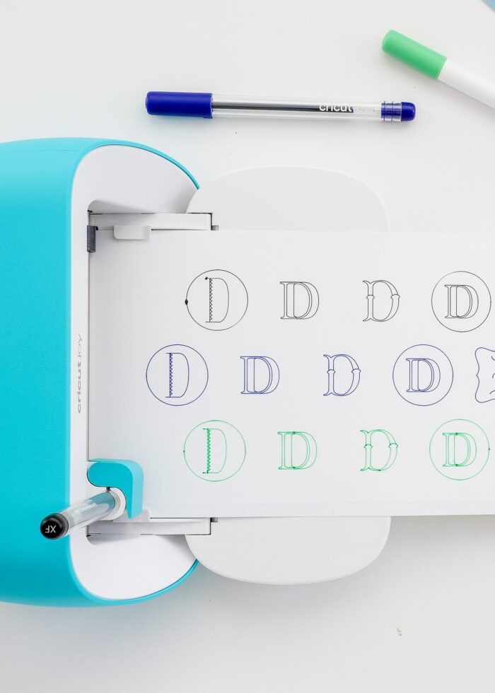 Cricut Joy writing stickers with letter "D" on them