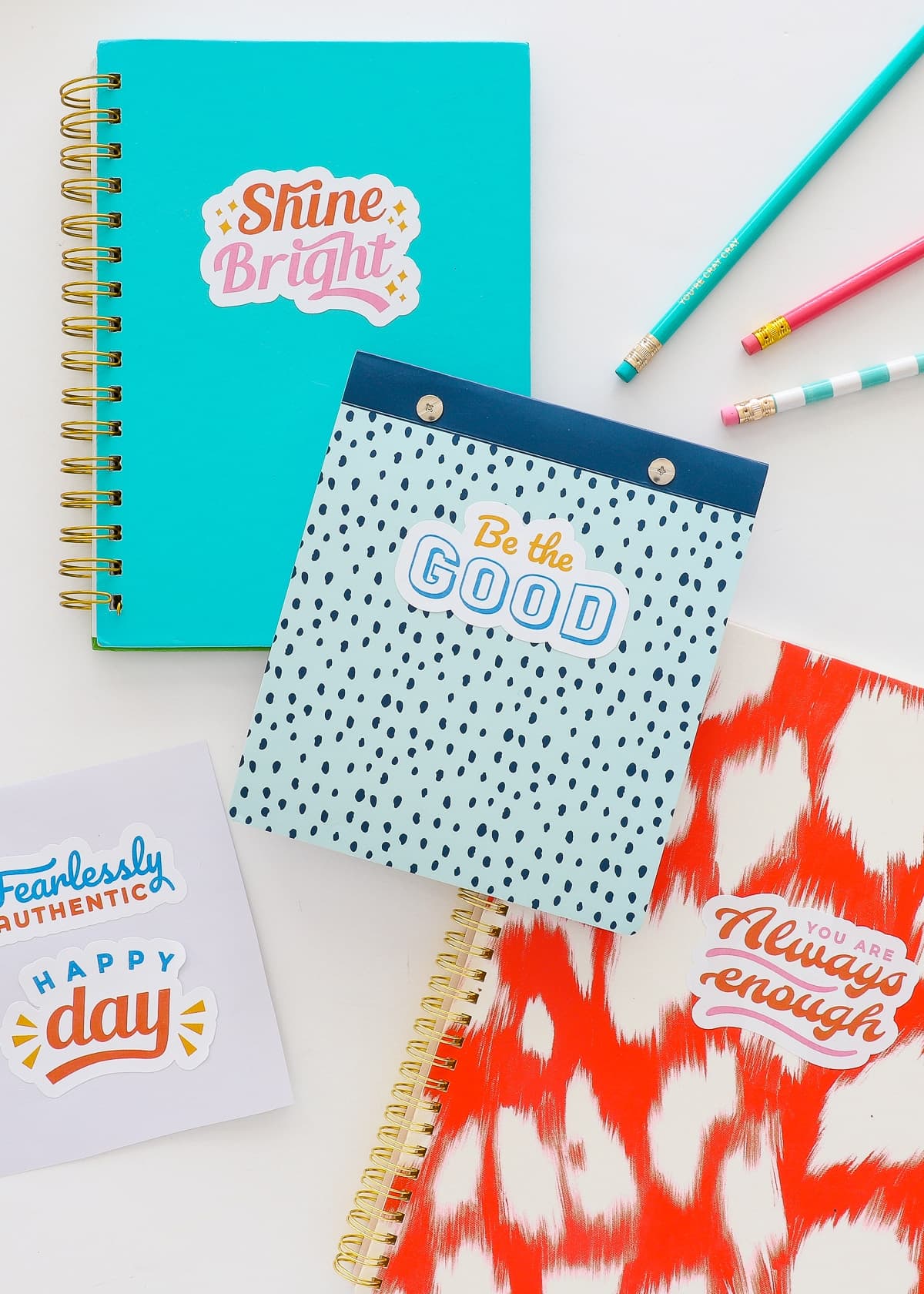 Sticker decals on colorful notebooks