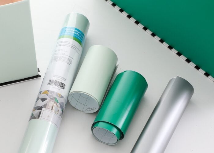 Rolls of green vinyl on a white table