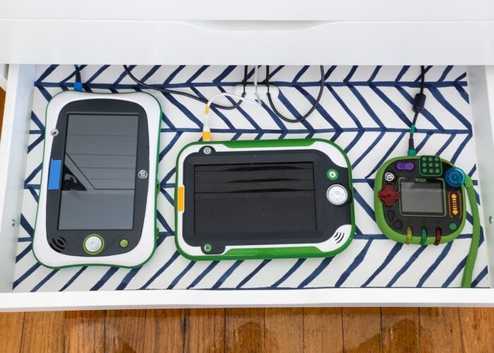 Kids electronics inside DIY Charging Station in bottom drawer of IKEA Alex drawers