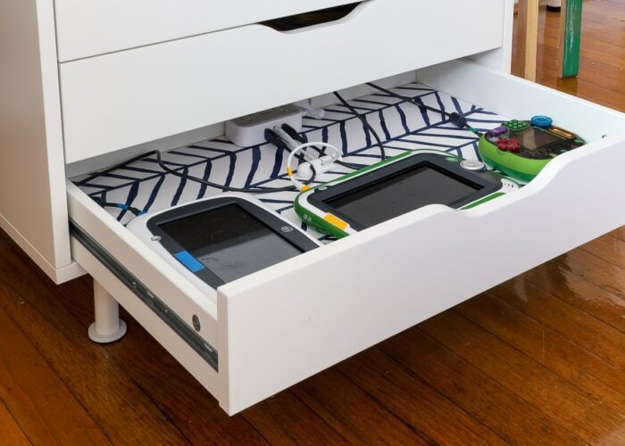 DIY Charging Station set up in bottom drawer of IKEA Alex unit to hold kids electronics