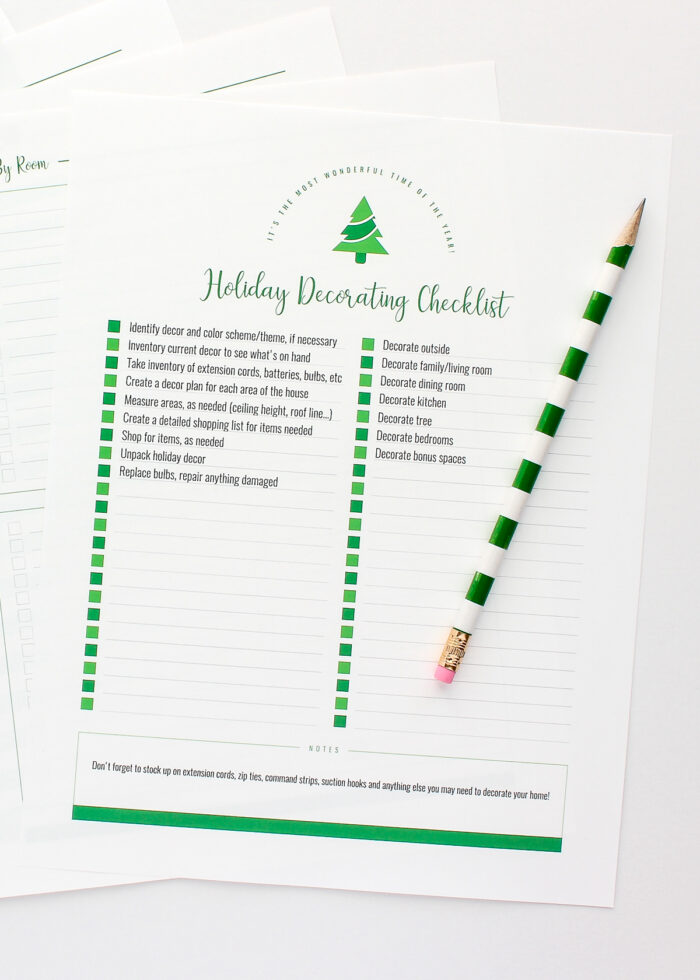 Holiday decorations checklist with green pencil
