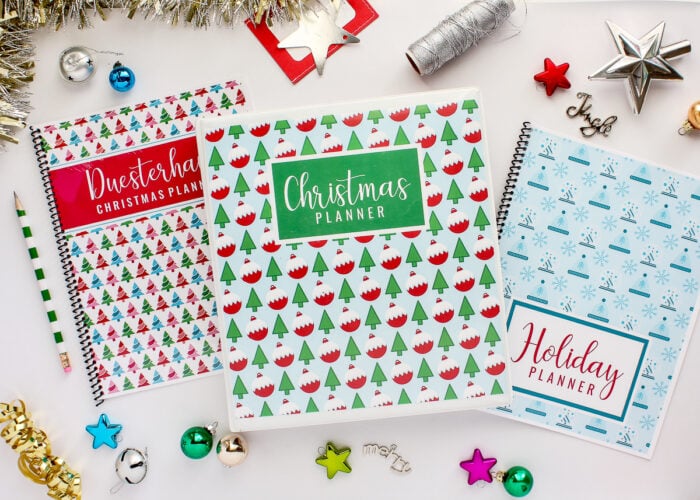 Set of three holiday planners on a white table