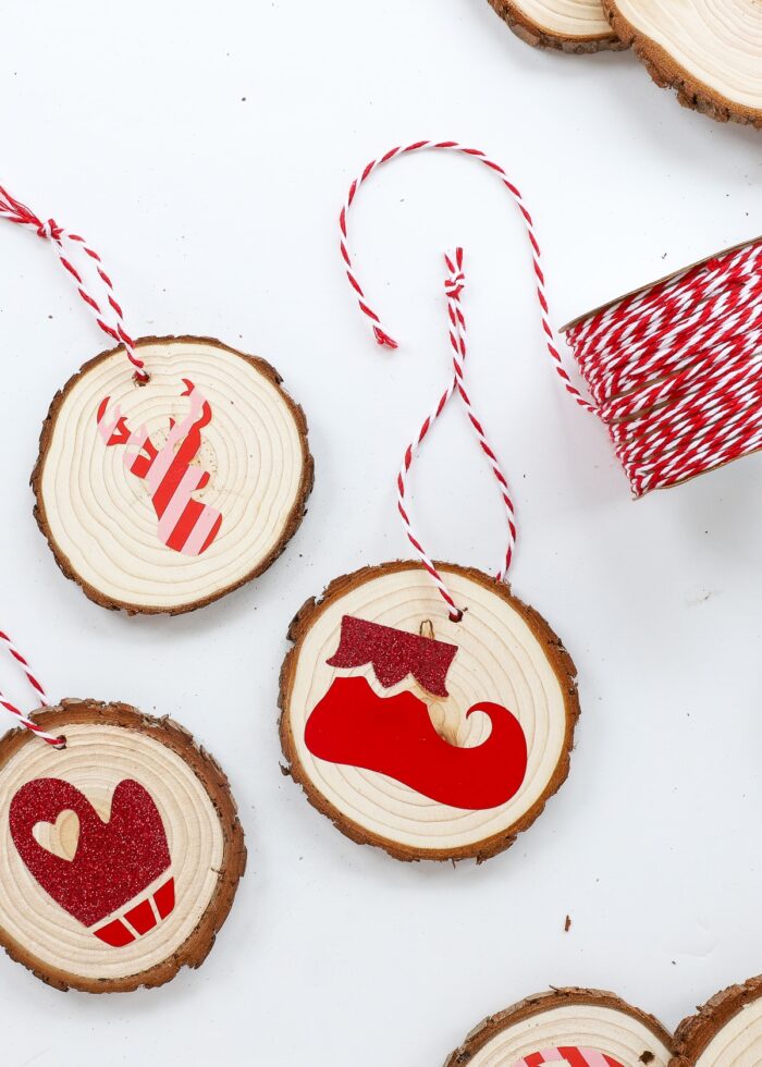 Red and white twine on a wood slice ornament
