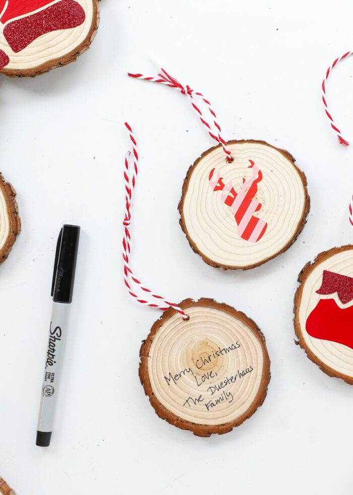 Written message on the back of a wood slice ornament