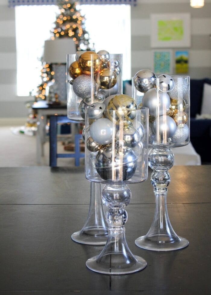 Neutral Christmas decor of Gold, silver, and white ornaments in glass jars