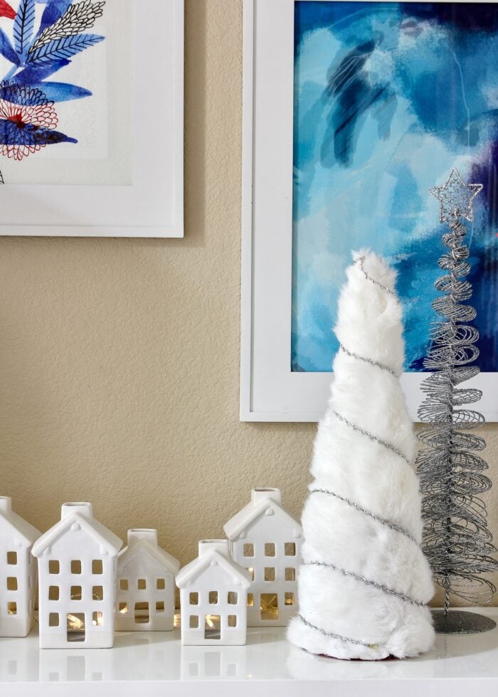 Neutral Christmas decor of white Christmas village with white and silver trees