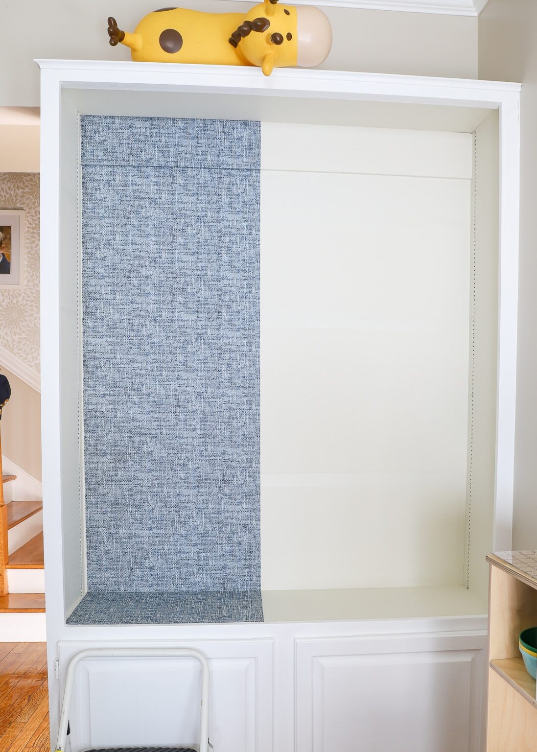 How to Wallpaper the Back of a Bookcase StepbyStep The Homes I