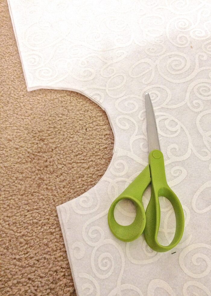 Scissors on top of cut out tree skirt