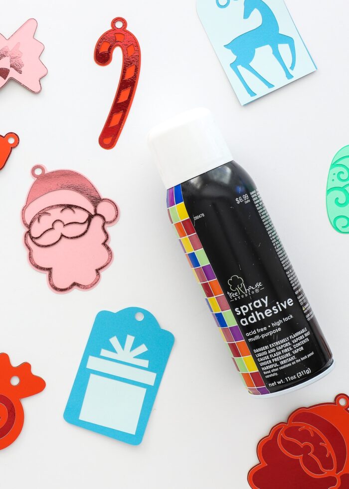 Spray adhesive shown next to DIY Gift Tags