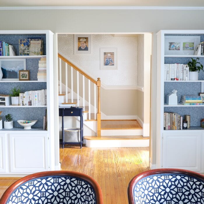 Built-in bookcases on either side of a cased opening