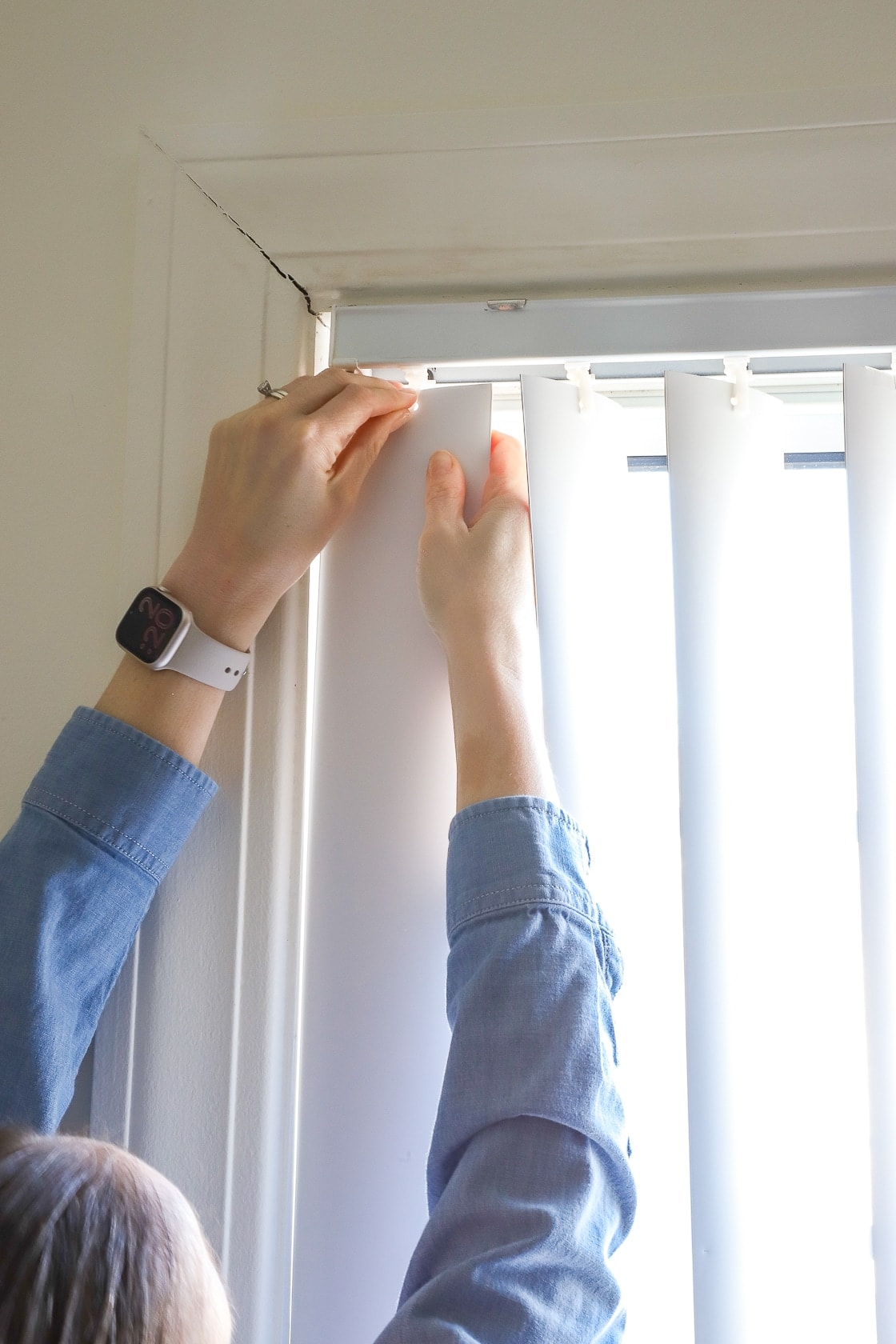 Hang trash bags on a curtain rod in the garage for easier access