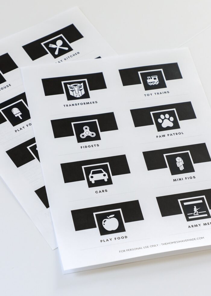 Printed black and white toy bin labels with pictures and text