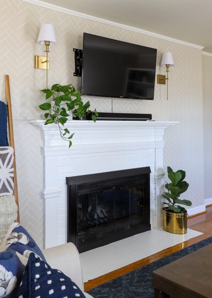 Fireplace accent wall with stenciled herringbone pattern on wall