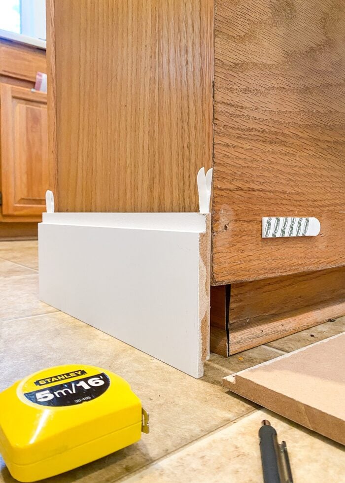 White shiplap on a kitchen island with Command Strips
