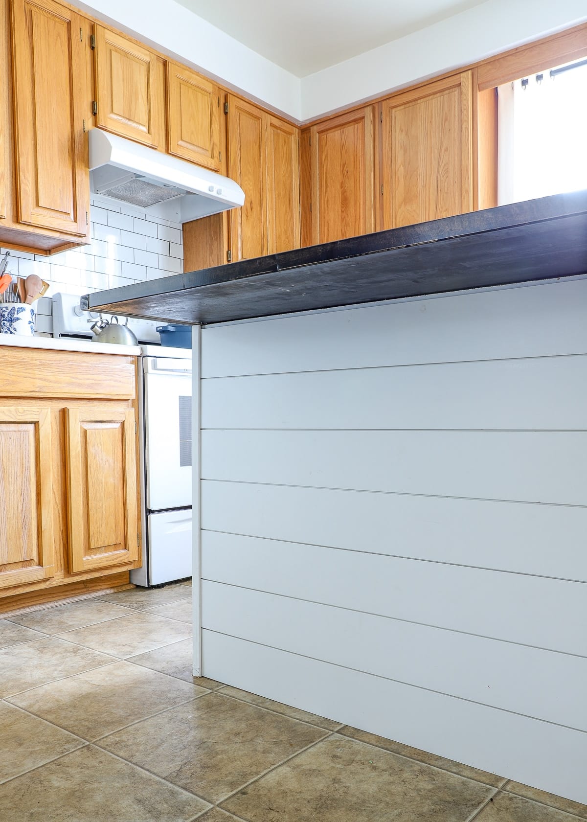 How to Shiplap a Kitchen Island with Command Strips - The Homes I Have Made