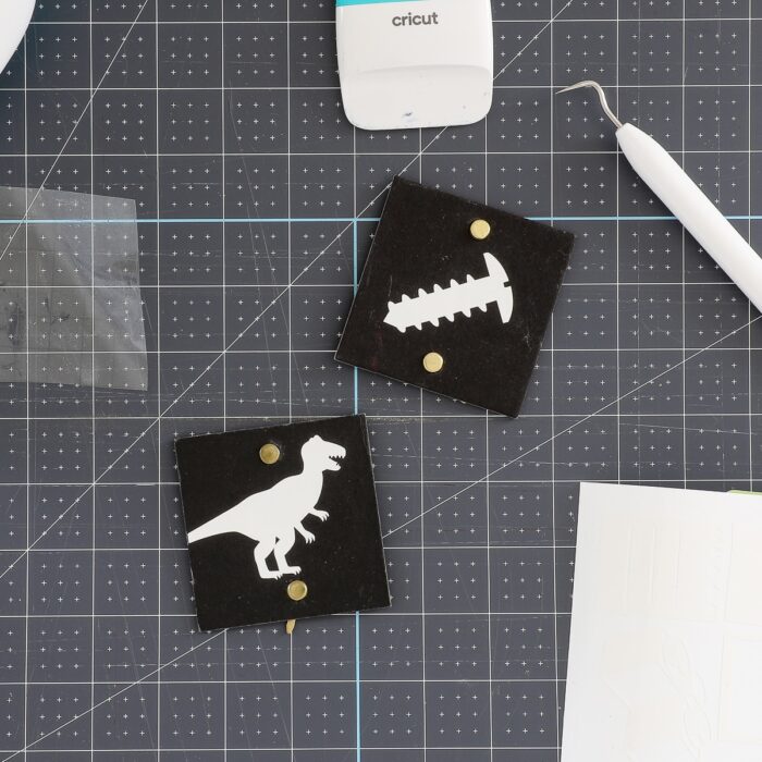 White playroom labels on black tags