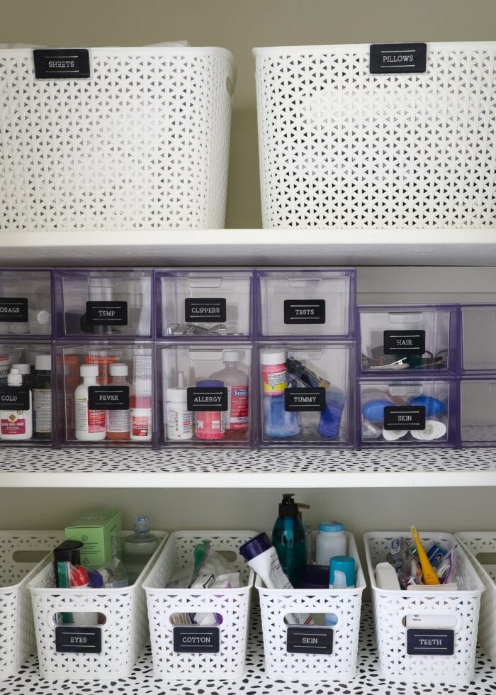 Clear acrylic drawers on a bathroom closet shelf