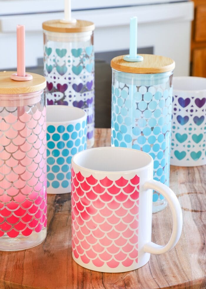 Water bottles and mugs covered in Cricut Color Changing Vinyl