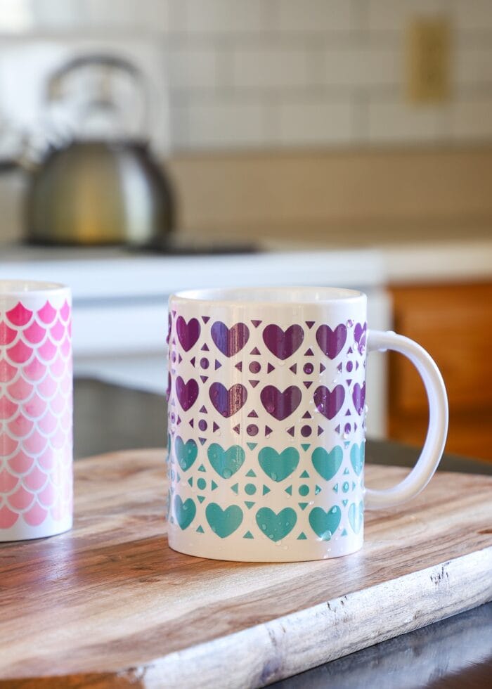 White coffee mug with heart pattern made with purple and teal Color Changing Vinyl