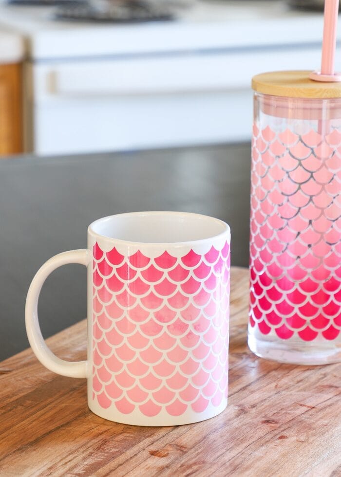 Light pink and bright pink Color Changing Vinyl on a mug and glass bottle