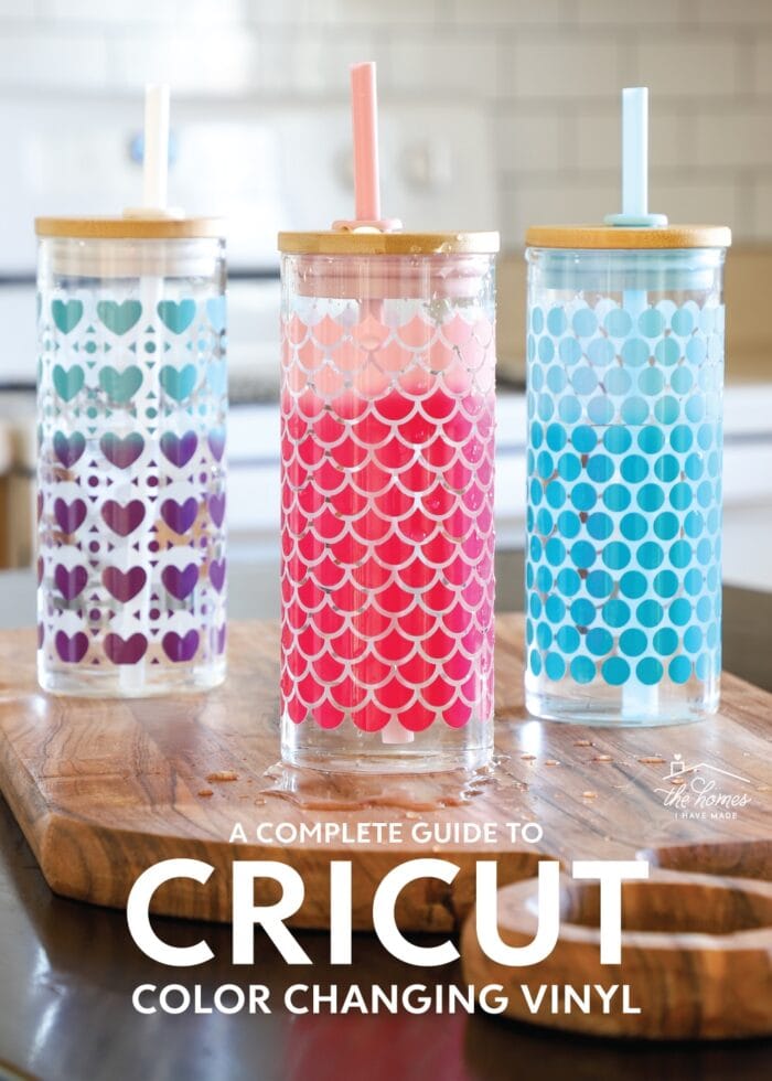 Glass water bottles covered in patterns made with Cricut Color Changing Vinyl