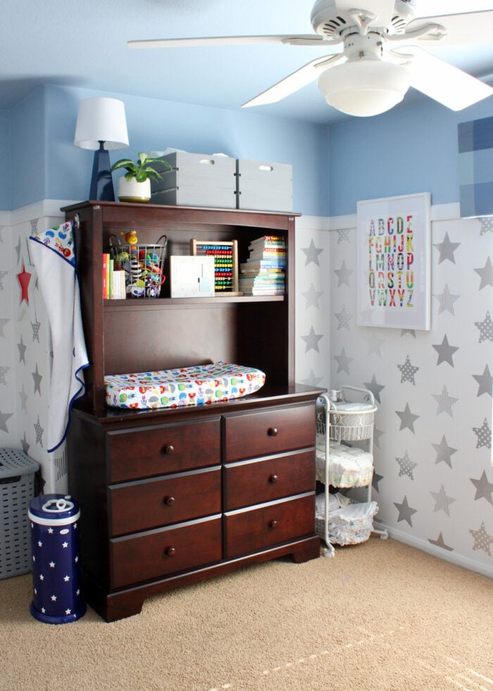 Nursery with light blue ceiling and star wallpaper