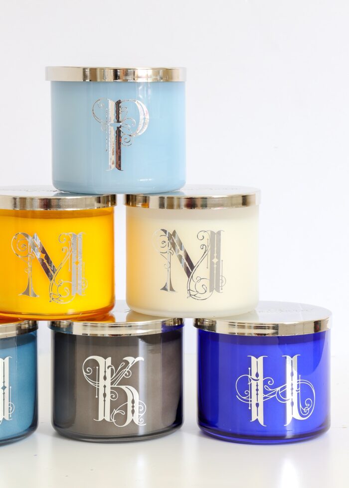 Silver monograms on decorative candles