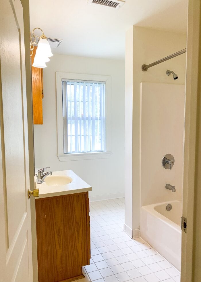 White builder basic bathroom with beige tile