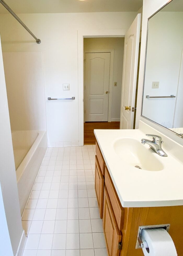 White builder basic bathroom with beige tile