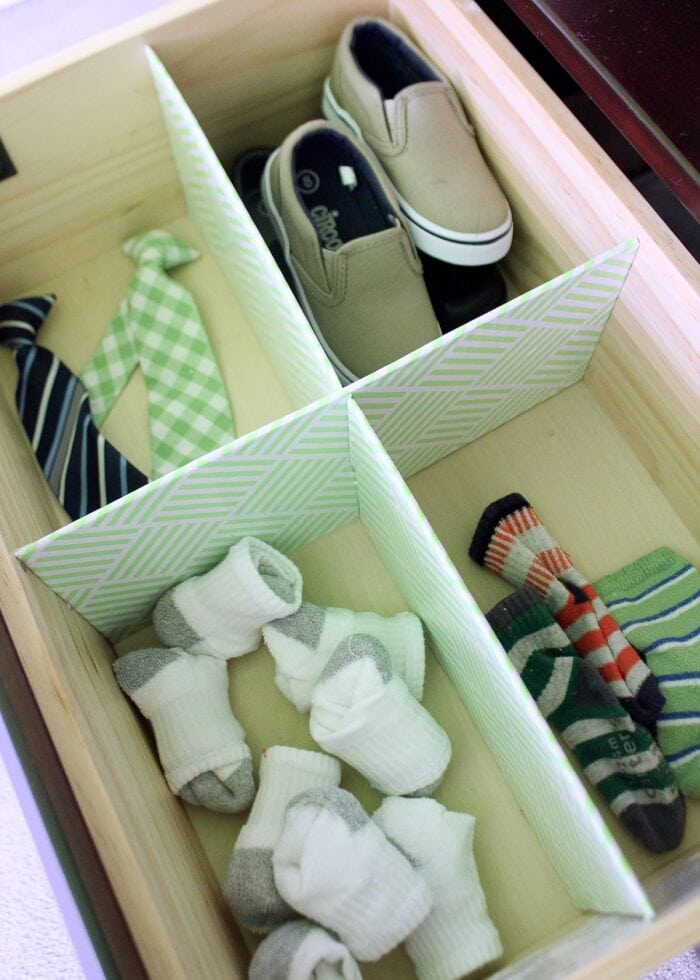 DIY Drawer Dividers in a kid's dresser drawer holding socks and shoes